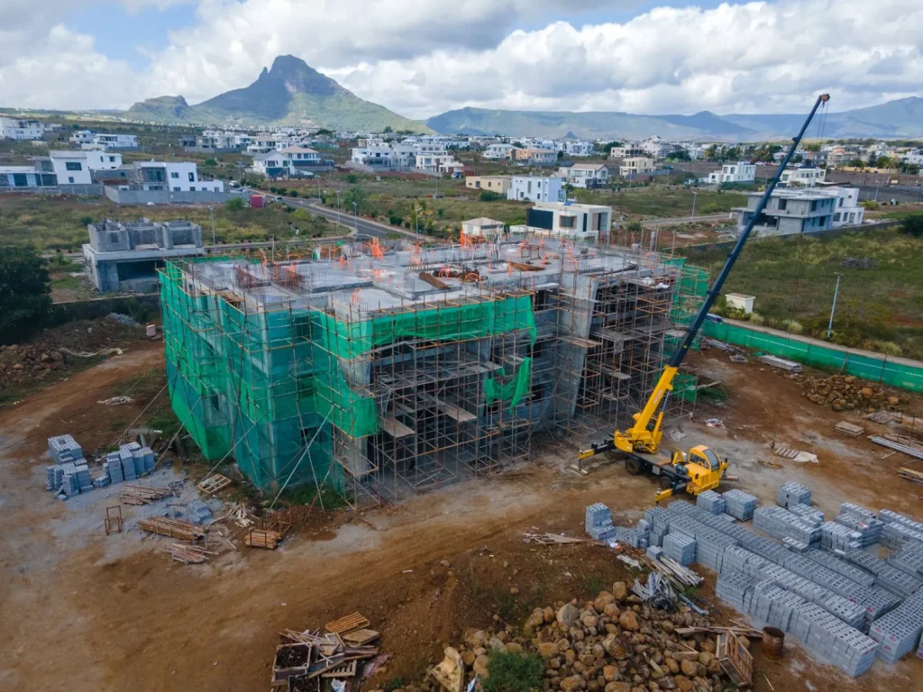 An Anna City block under construction with a crane alongside, September 2026